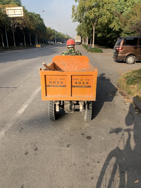 An electric utility vehicle loaded with tools, ready for a day of work on a sunny construction site