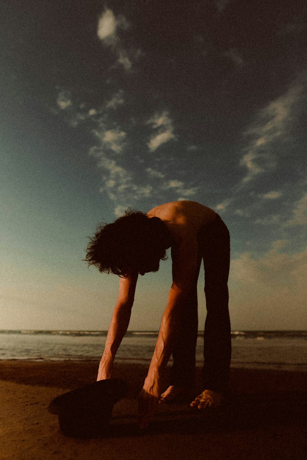 man standing on seashore