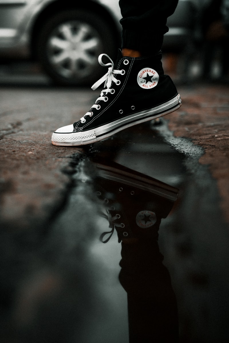 Converse Chuck Taylor over a rain puddle