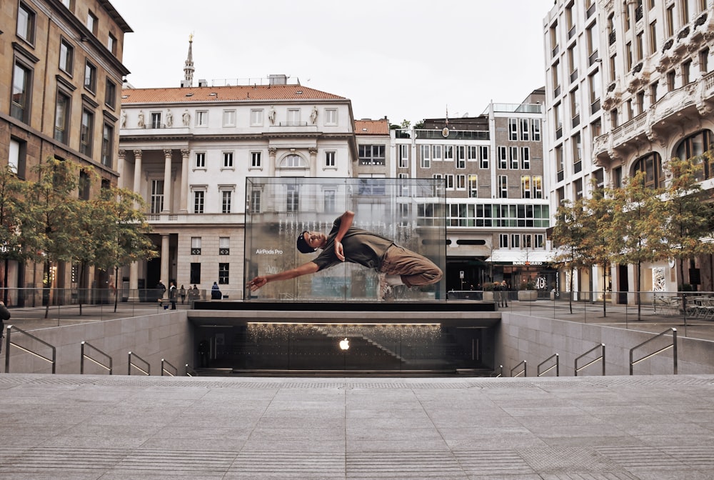 man jumping over cement stairs