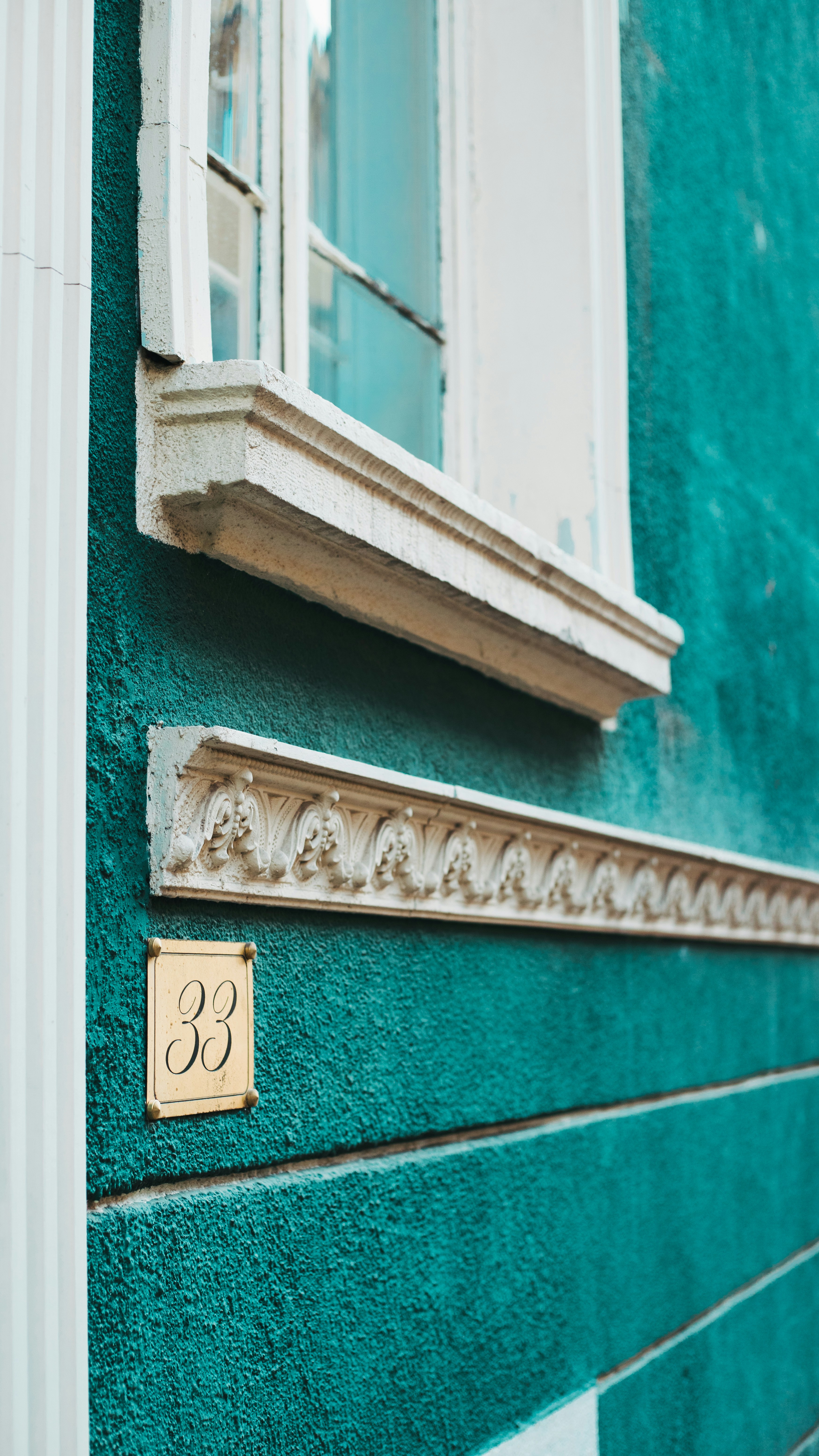 teal and white building
