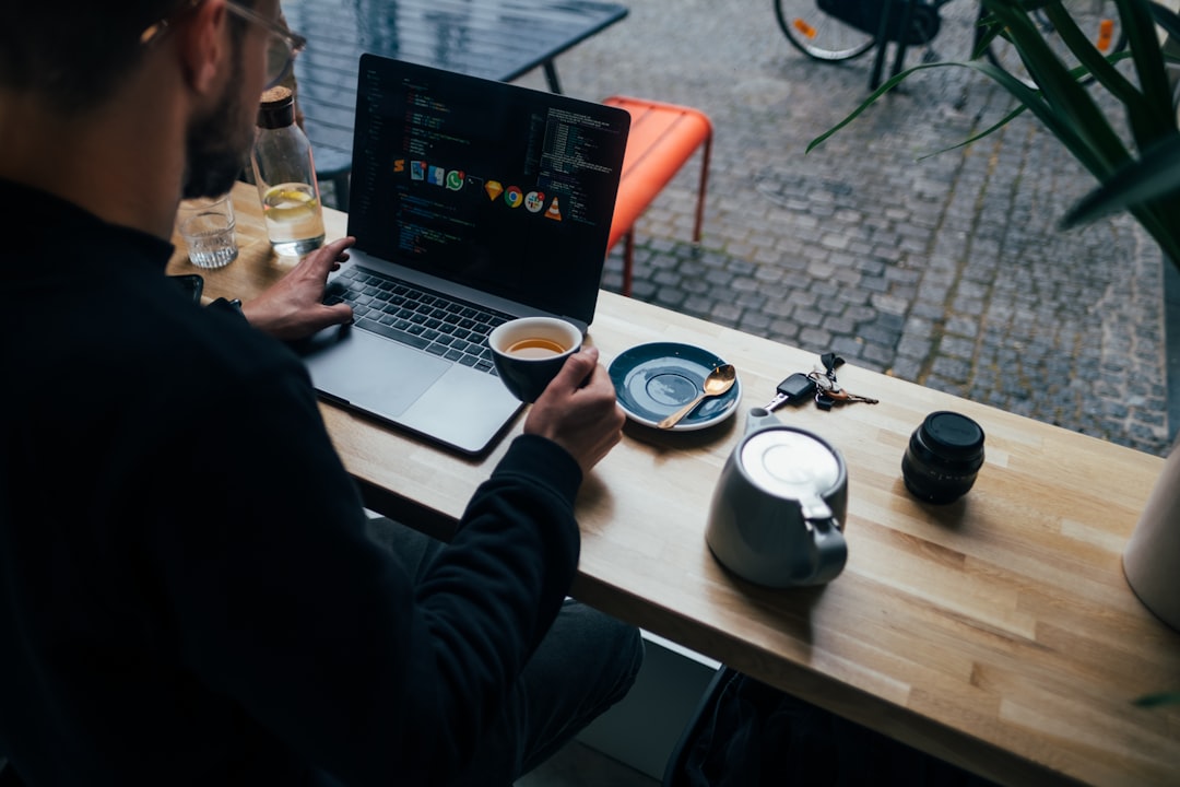 man holding a cup with coffee