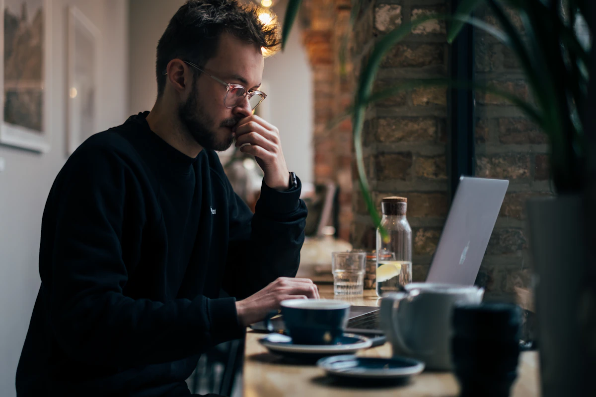 Small business owner reviewing marketing results on a laptop