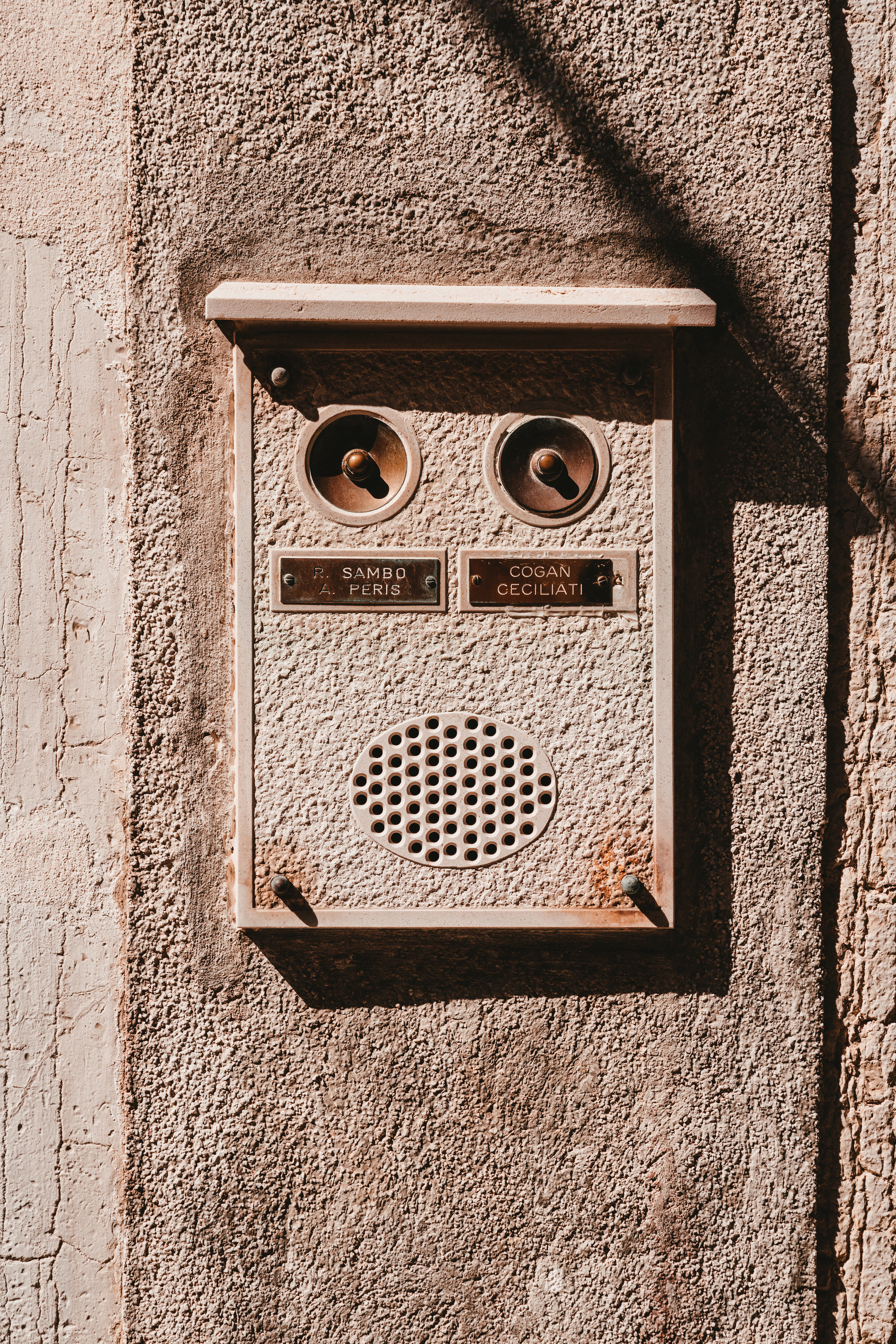 Smart doorbell device mounted on a wall