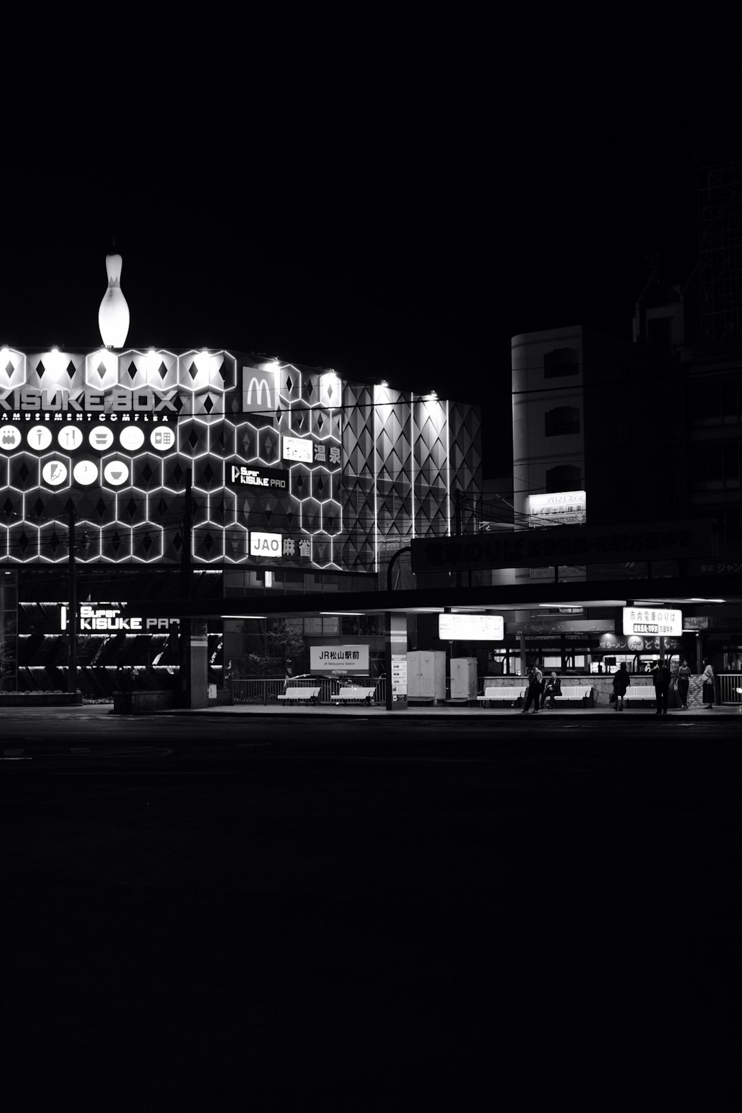 gray-scale photography of lighted honeycomb building