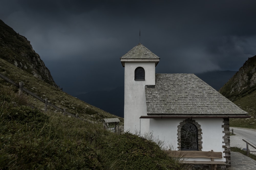 white and gray concrete house under cloudy sky