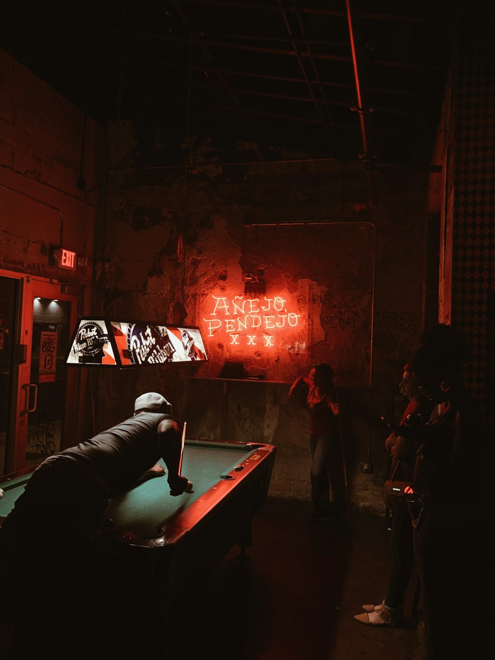 man playing billiard pool inside building