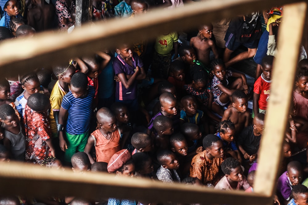 a large group of people standing around each other