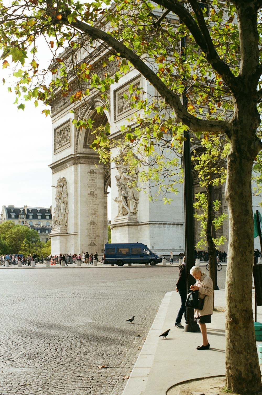 people walking near Arc de Triomphe