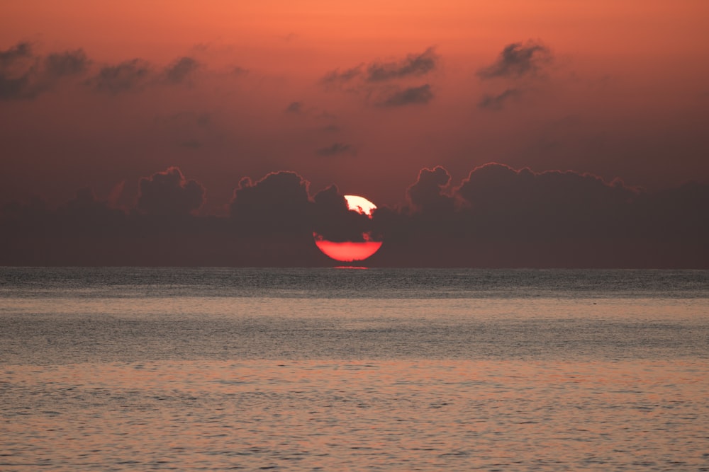 calm body of water during horizon