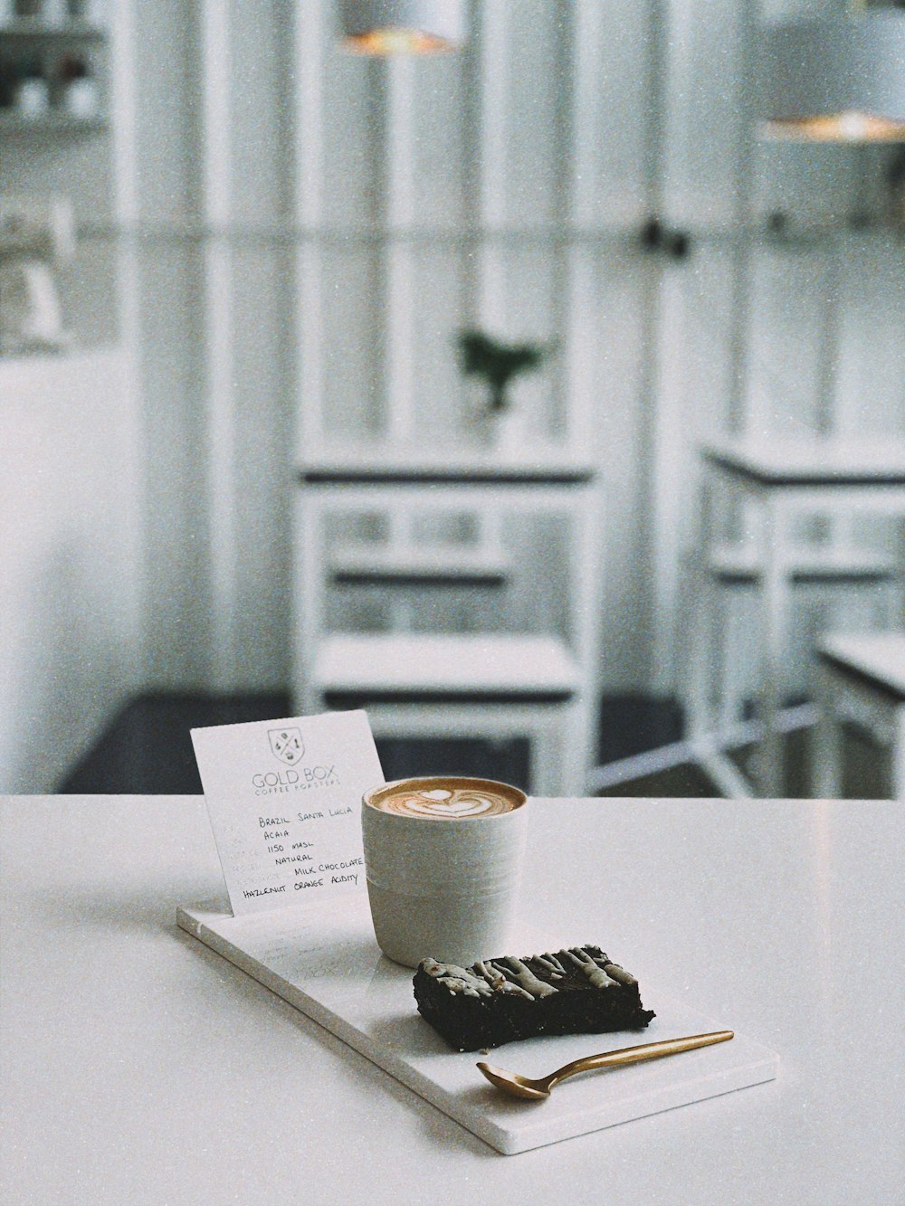 white mug on white table