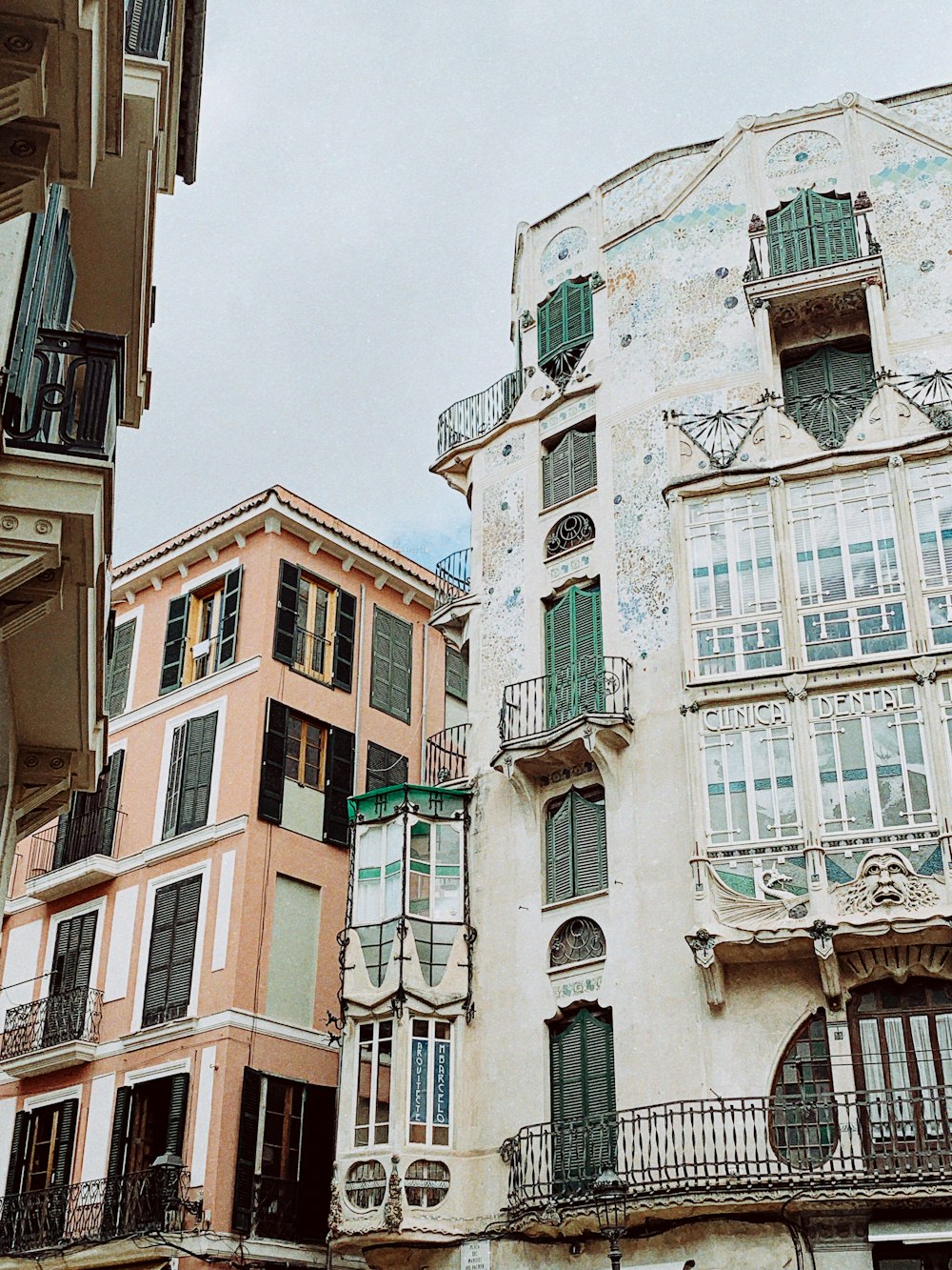 a group of buildings with balconies and balconies on them