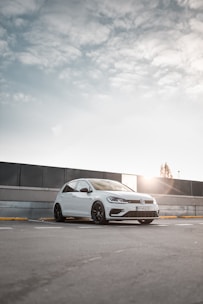white 5-door hatchback under white clouds