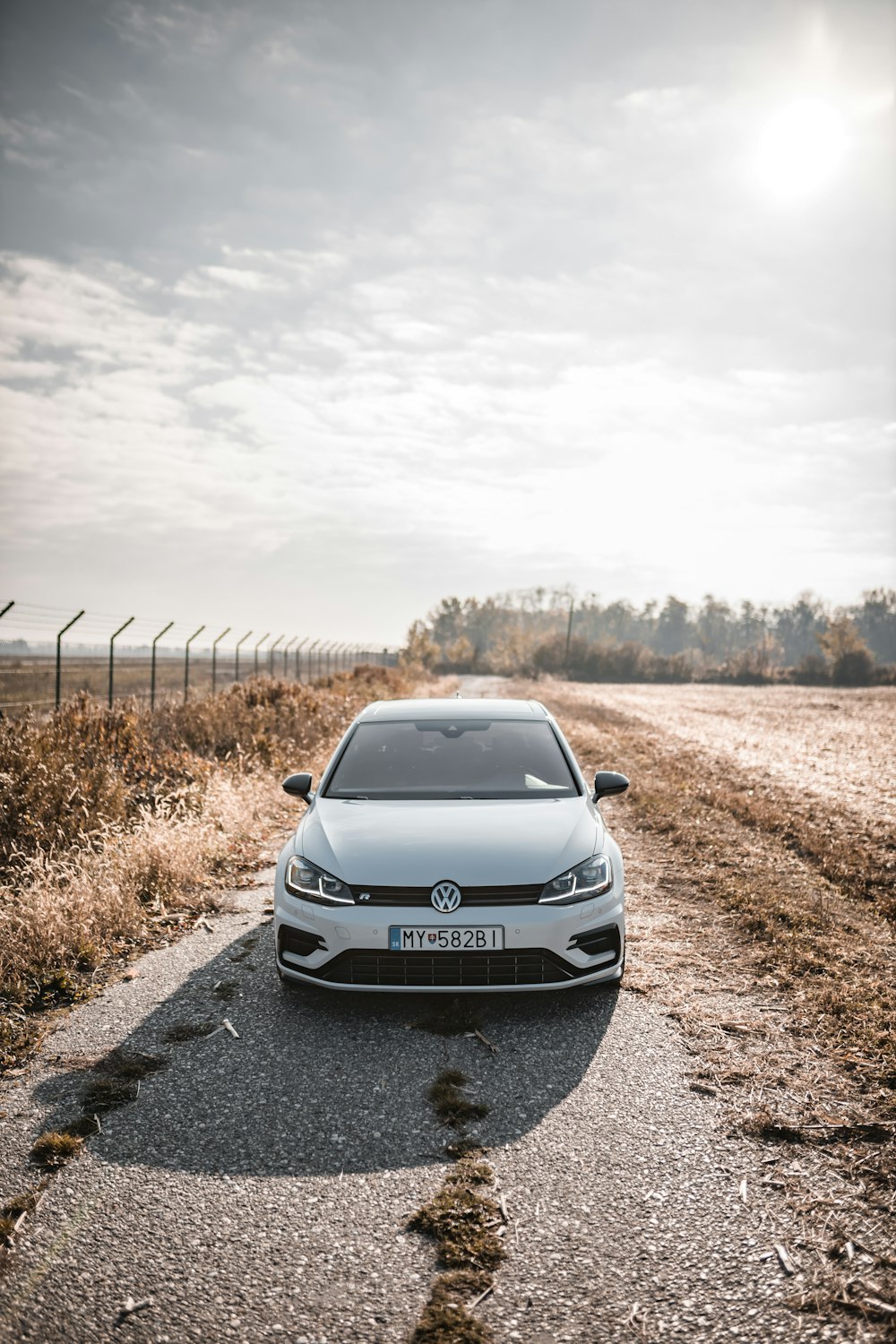 white Volkswagen hatchback