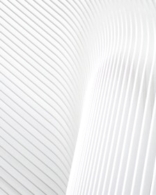 a close up of a white wall with wavy lines