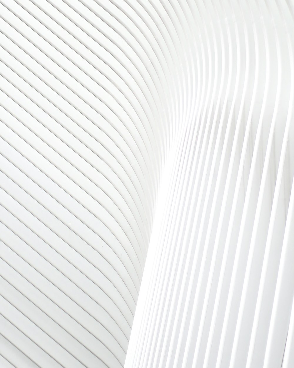 a close up of a white wall with wavy lines