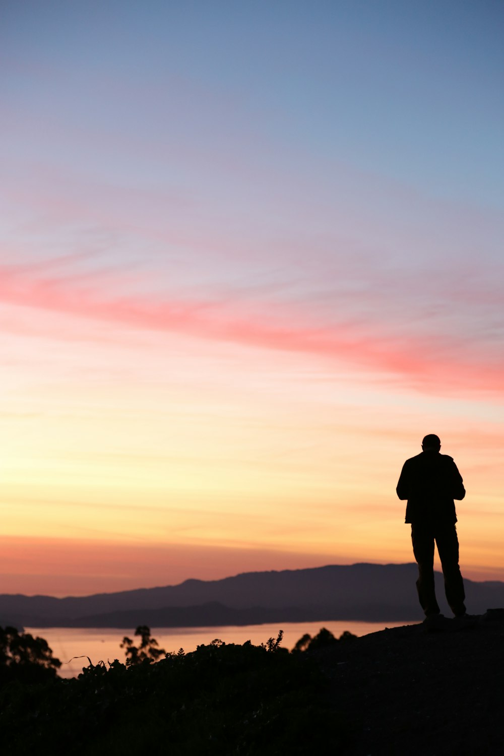 man stands on top of the mountains