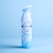 A Febreze air freshener spray can with a light blue and white design is positioned against a matching light blue background. The can features an image of flowing fabric and the words 'AIR' along with the scent 'linen & sky'.