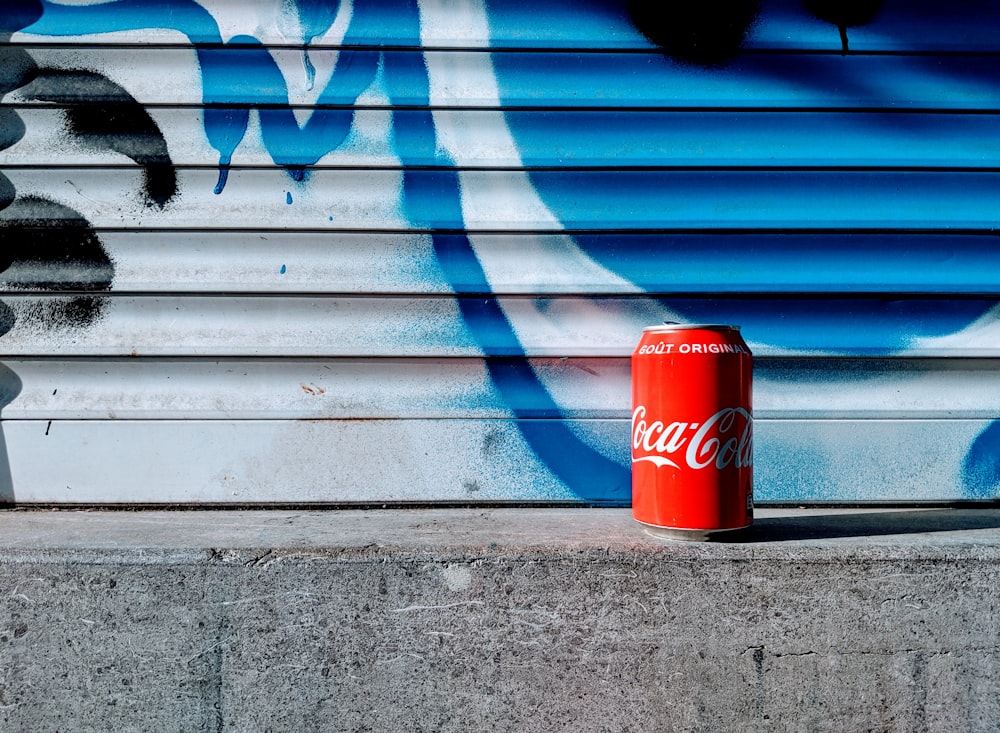 Coca-Cola soda can on gray concrete surface
