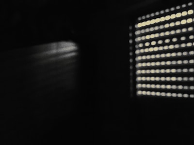 Bright room with horizontal blinds casting gentle shadows on the walls.