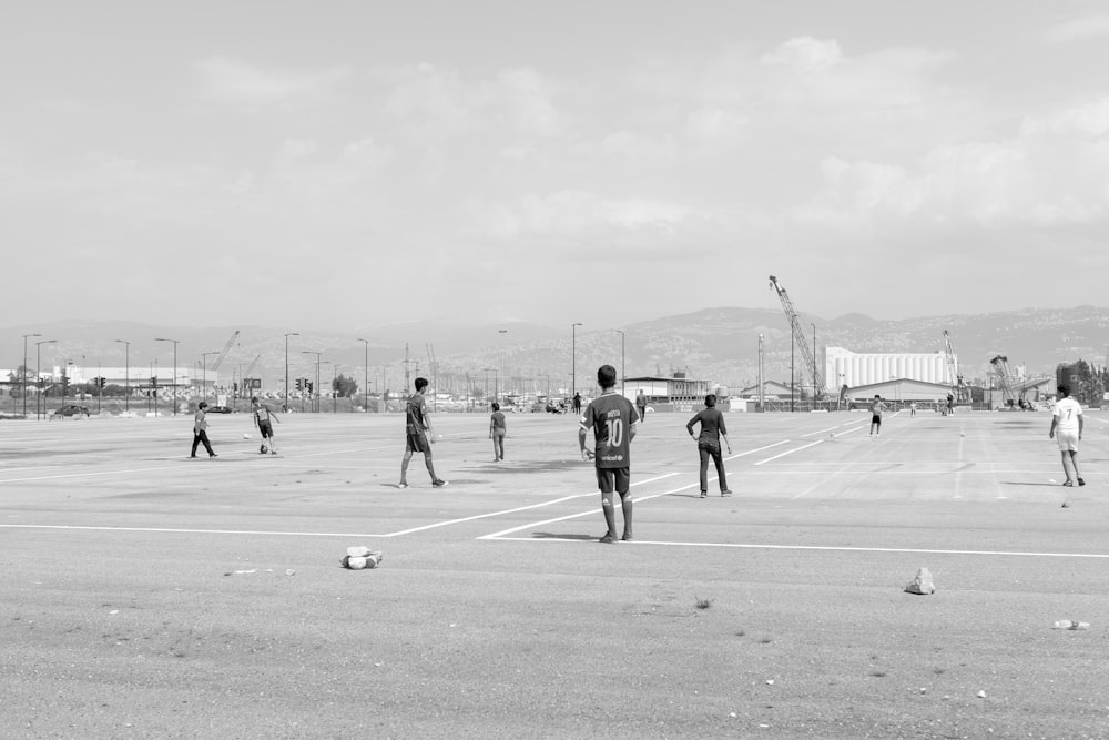 men playing on field photo