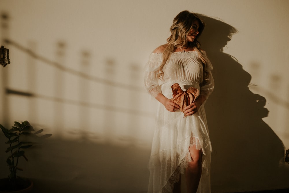 woman wearing white long-sleeved dress