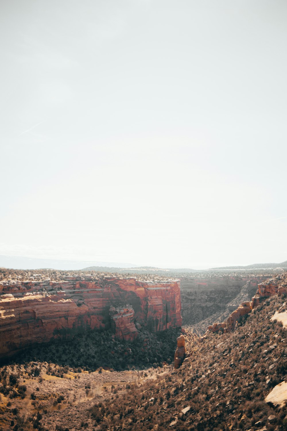 brown land formation under blue sky