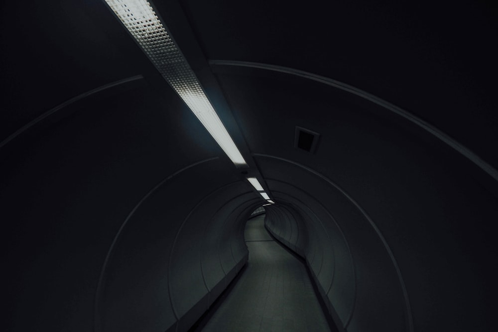 dimly lit gray tunnel