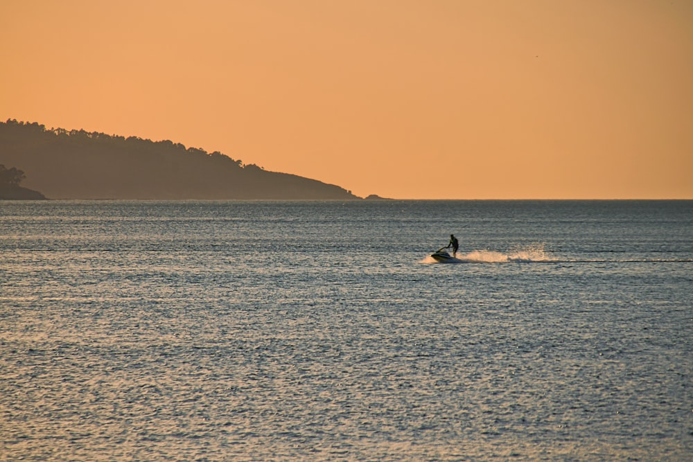 person riding on personal watercraft