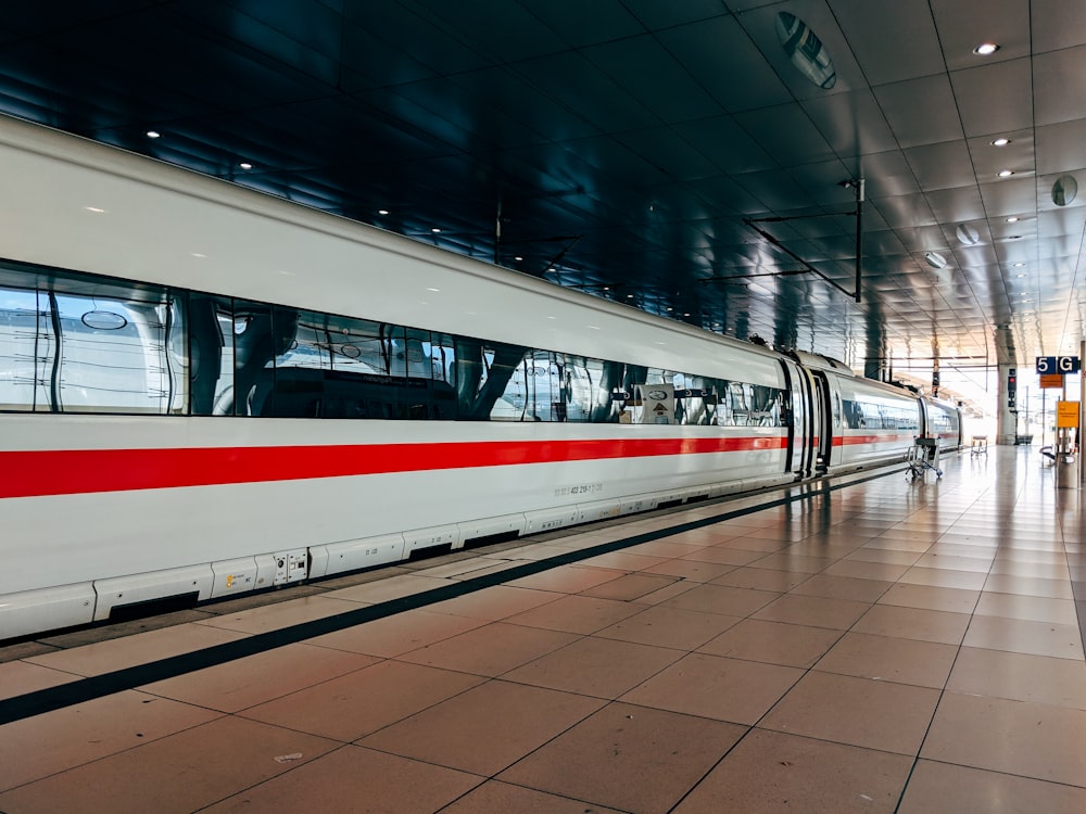 white and red train during daytime