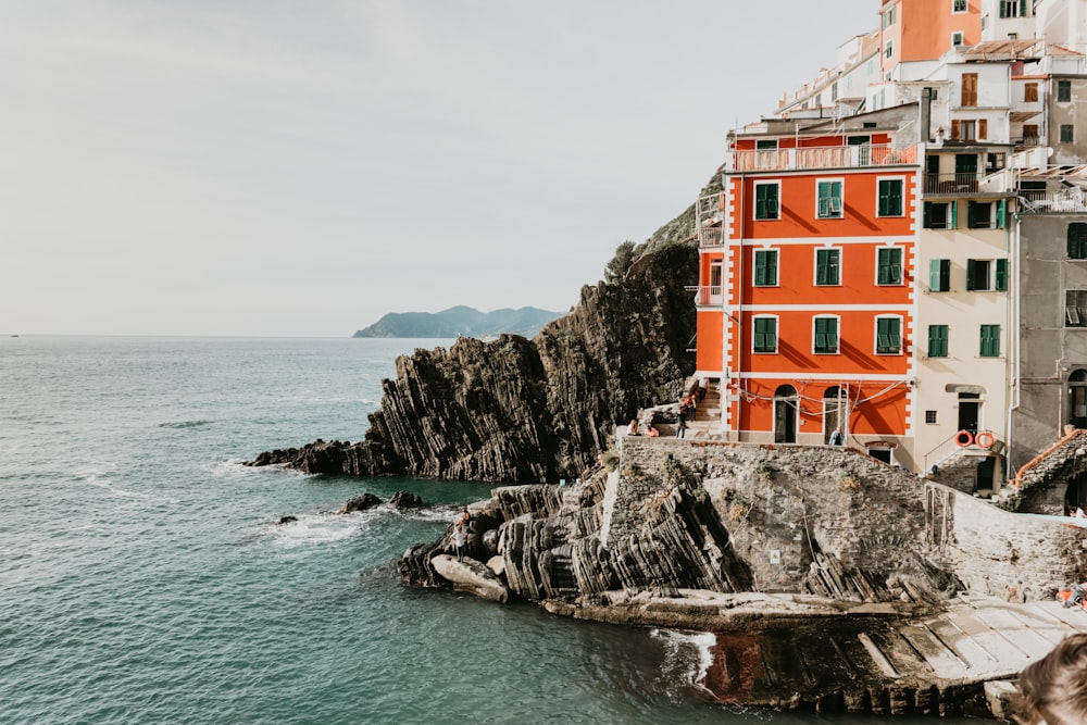 aerial photography of white and red hotel by the sea