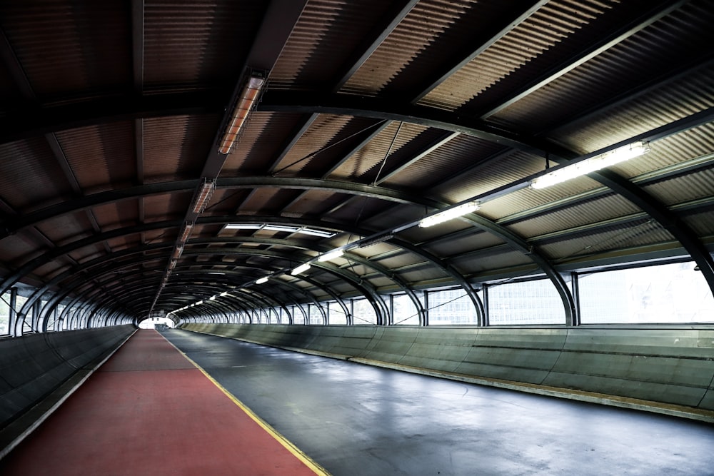 empty pathway under a metal ceiling