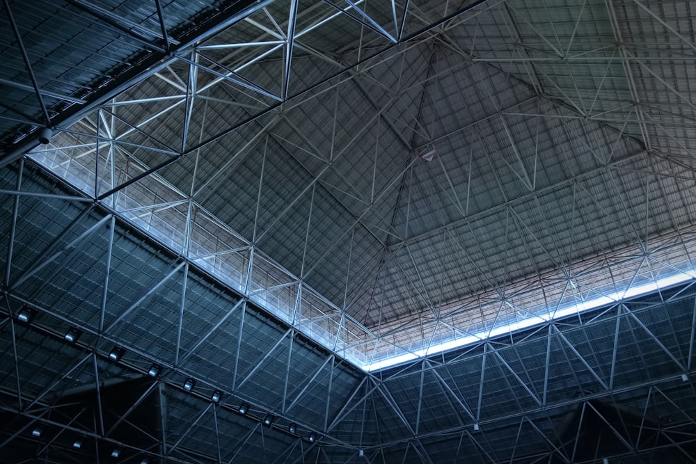 the ceiling of a stadium with a clock on it