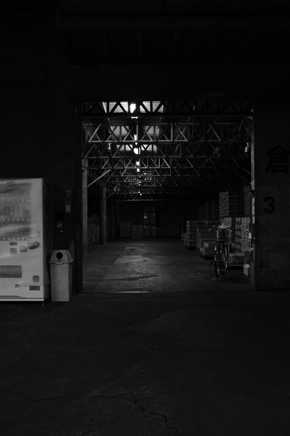a black and white photo of a warehouse