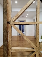 A wooden frame constructed neatly inside a basement for new drywall.