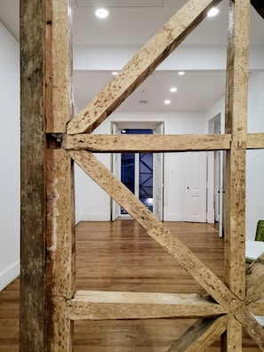 A wooden frame constructed neatly inside a basement for new drywall.