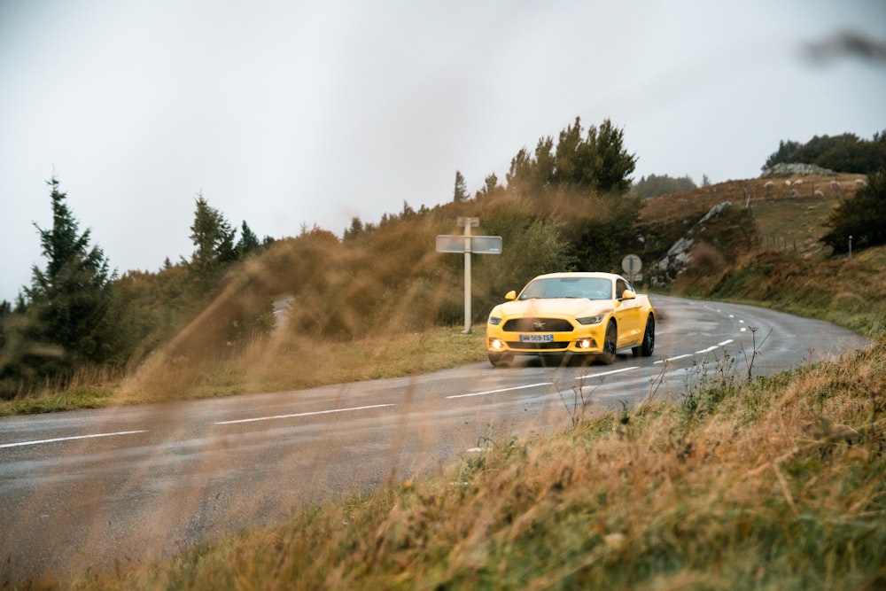 yellow car on road