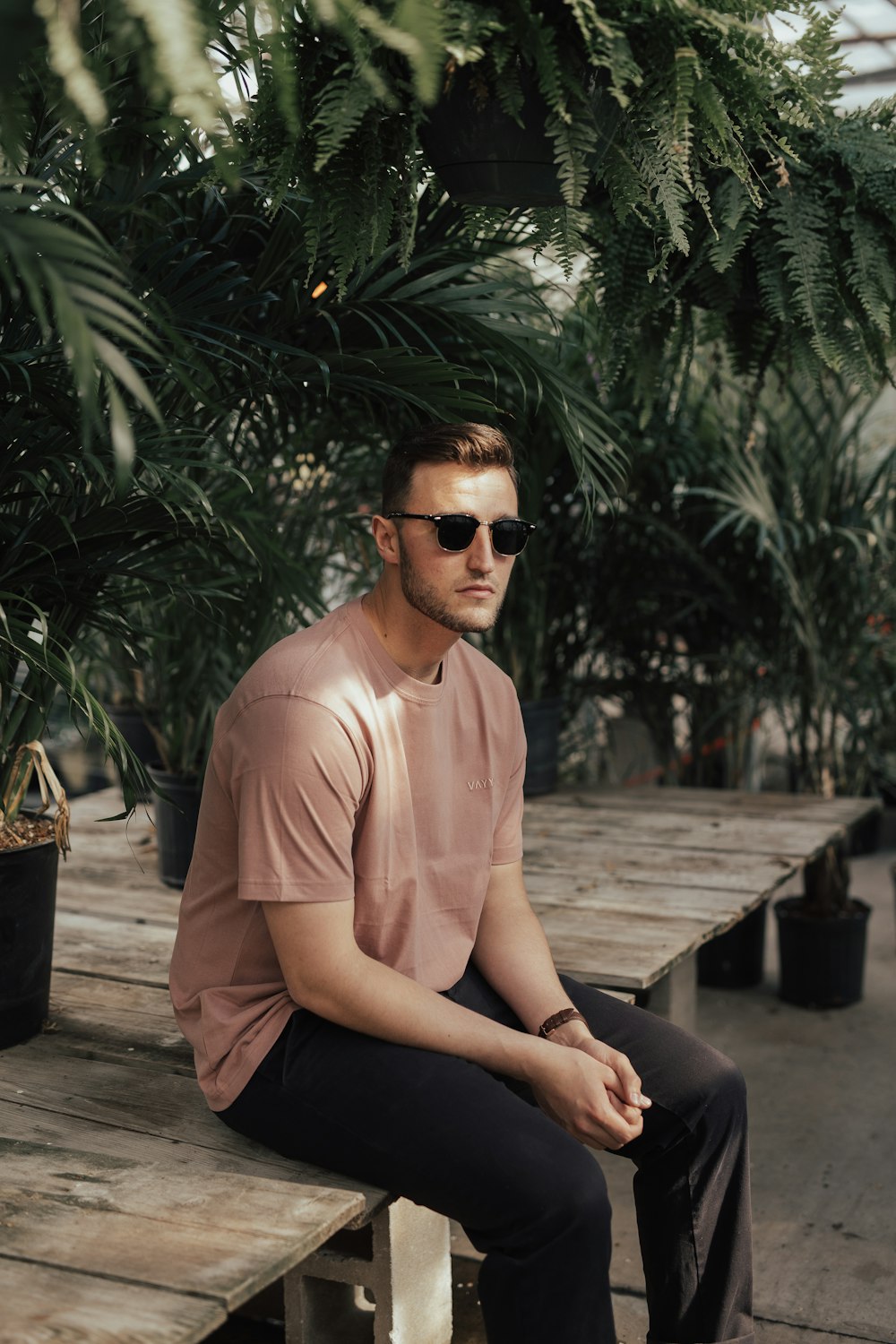 man sitting on wooden flooring