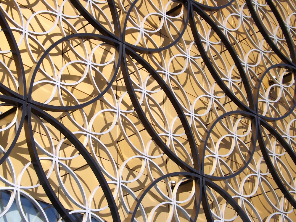 a close up of a metal wall with circles on it