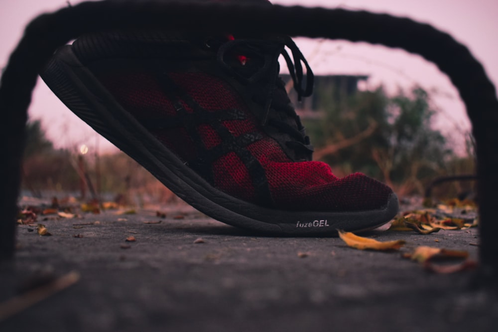 red and black Asics shoe