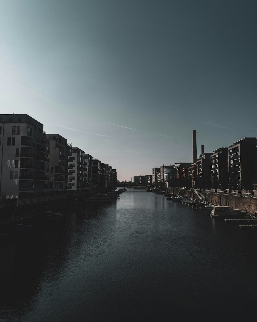 canal between concrete buildings