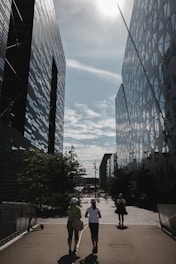 A group of happy tourists enjoying a guided city walk under sunny skies.
