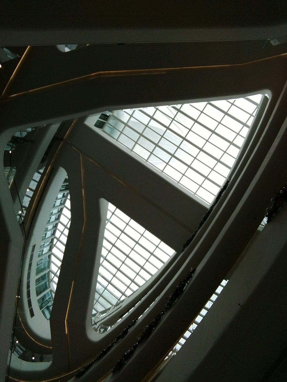 the ceiling of a building with a lot of windows