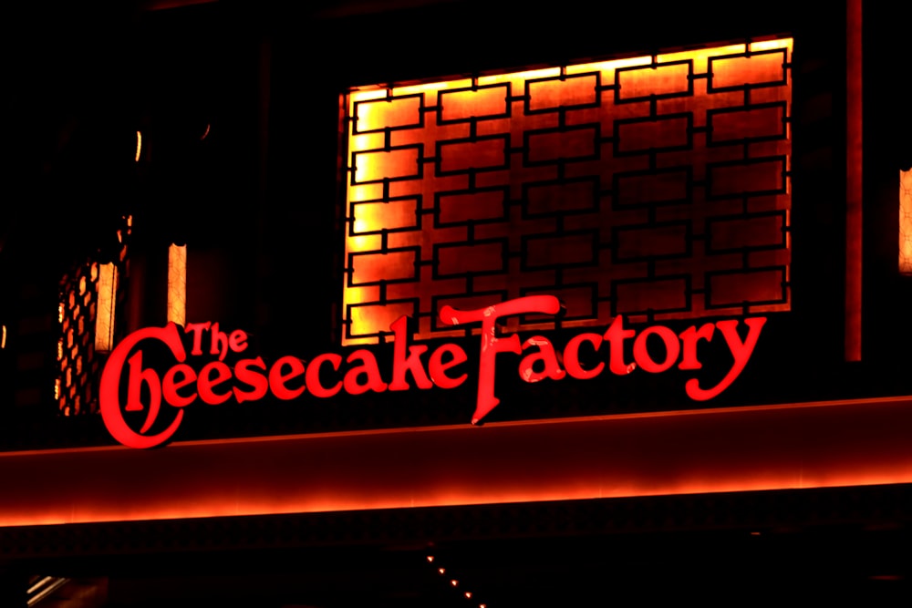 shallow focus photo of The Cheesecake Factory signage
