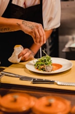 man standing front of plate with vegetable