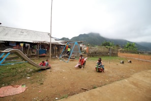 Children playing sports in the village playground.