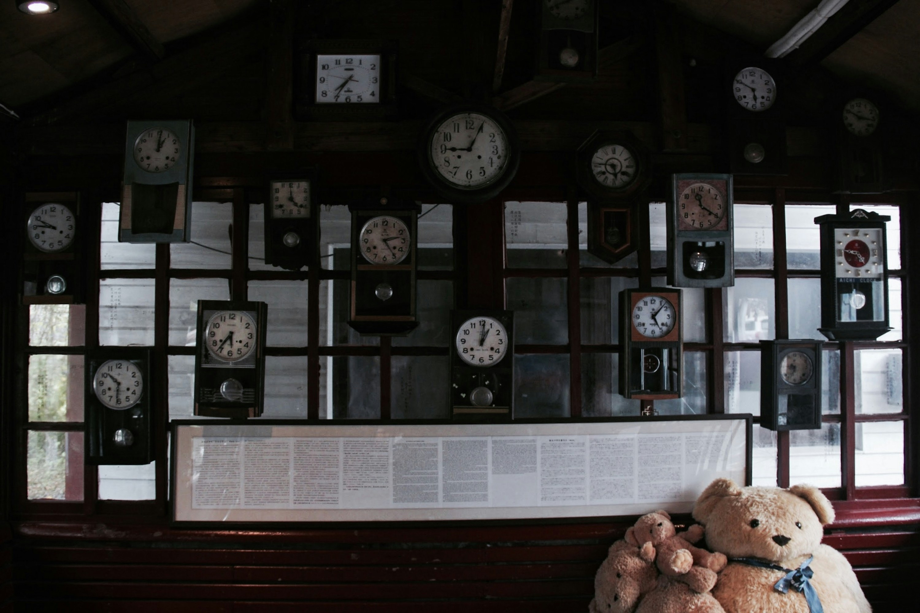 An old man sitting in a small clock repair shop filled with vintage clocks, warm light, nostalgic mood
