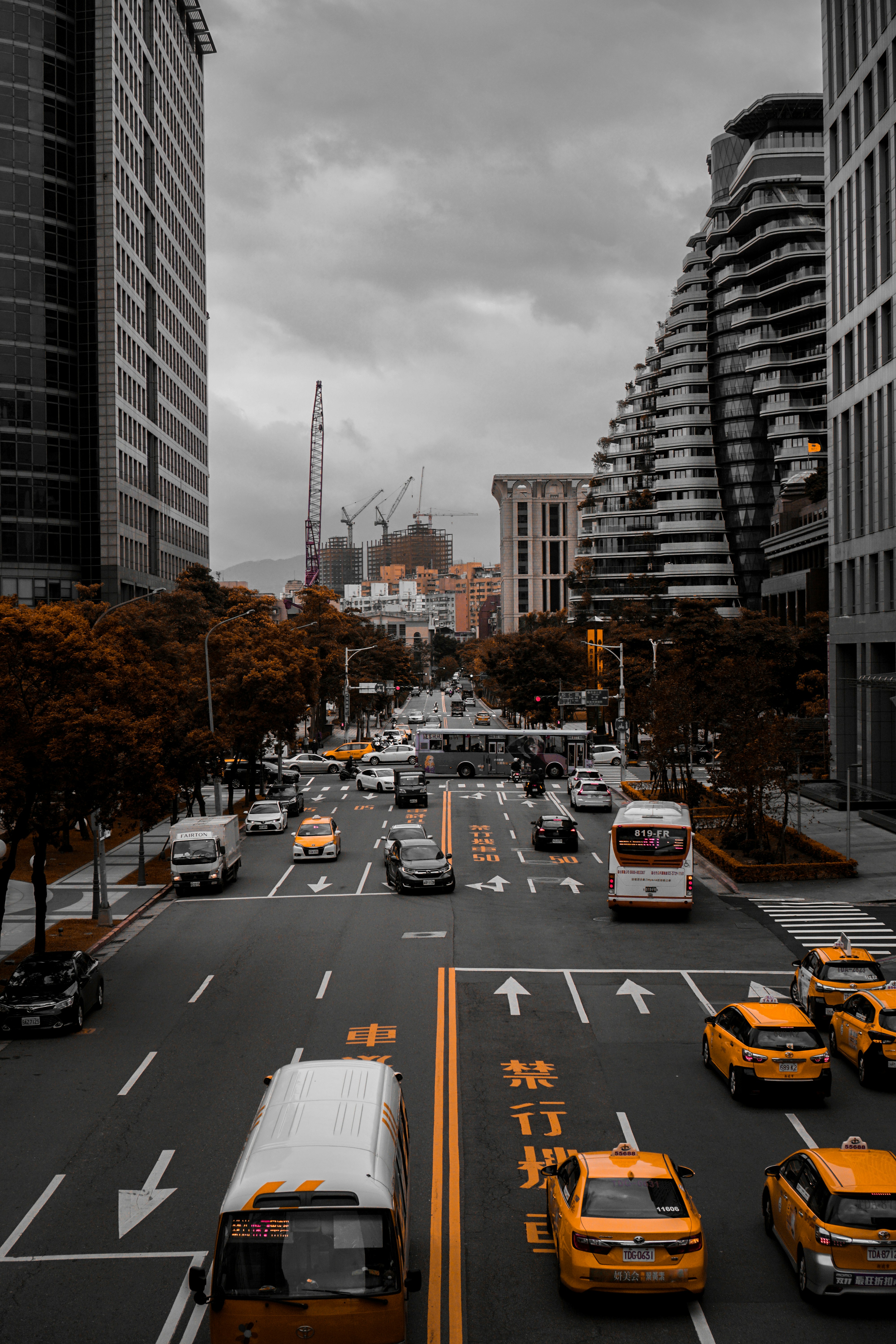 selective photography of vehicle travelling in city