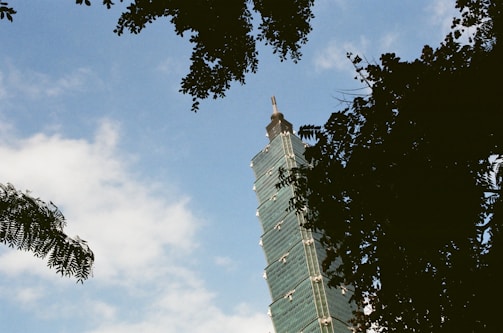 High-rise building framework rising against a clear blue sky.