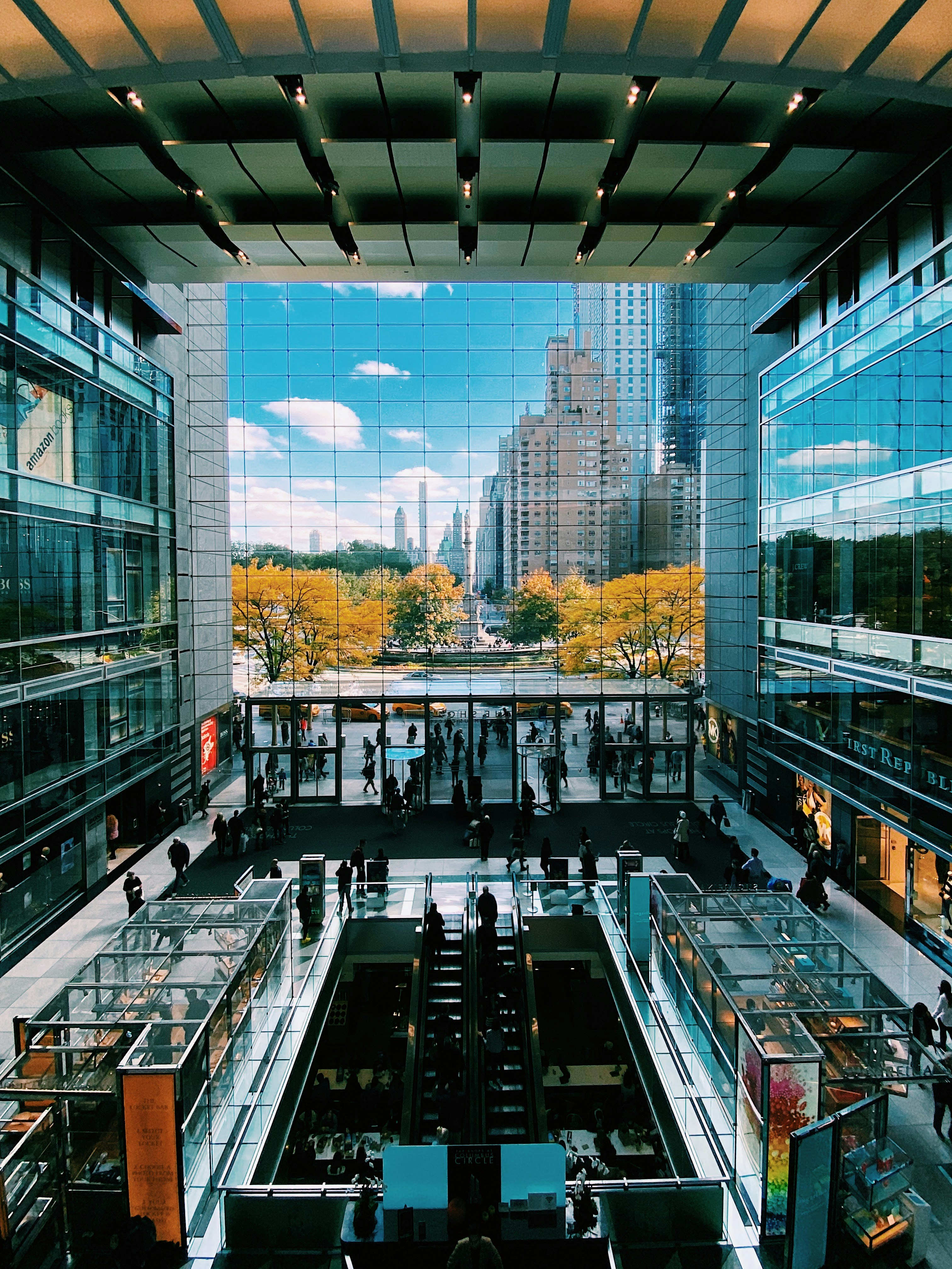 Real estate agent showing a family a spacious home with bright natural lighting.
